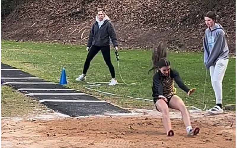 Photo by Hali McClure Micalynn McClure competes in her first triple jump.