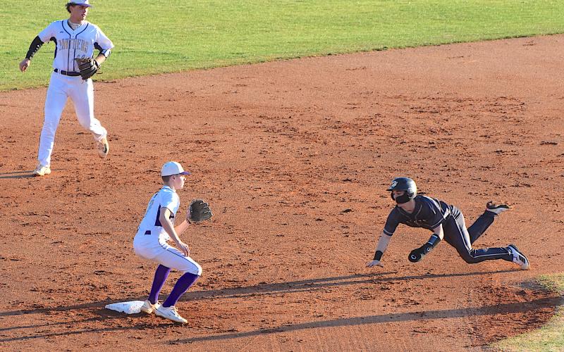Gary Corsair • Clay County Progress Hayesville speed merchant Michael Mauney steals second base at Union County.