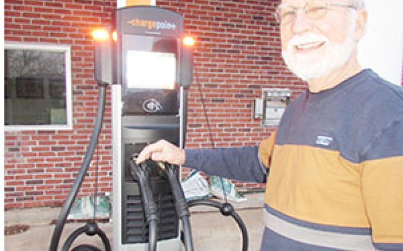 Mayor Joe Slaton shows off new EV charging station behind Town Hall.