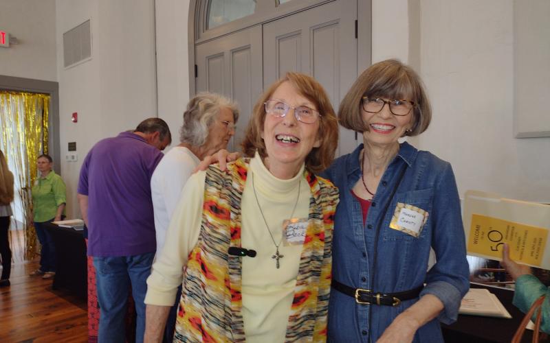 Photo by Tess Thomas Clay County Historical &amp; Arts Council co-presidents, from left, Reba Beck and Marsha Christy, enjoy a moment together during the CCHAC 50th anniversary party.
