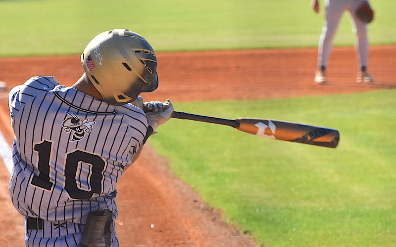 Gary Corsair• Clay County Progress Hayesville third baseman Chance Hughes connects against Robbinsville in the Yellow Jackets 11-1 triumph on Monday.
