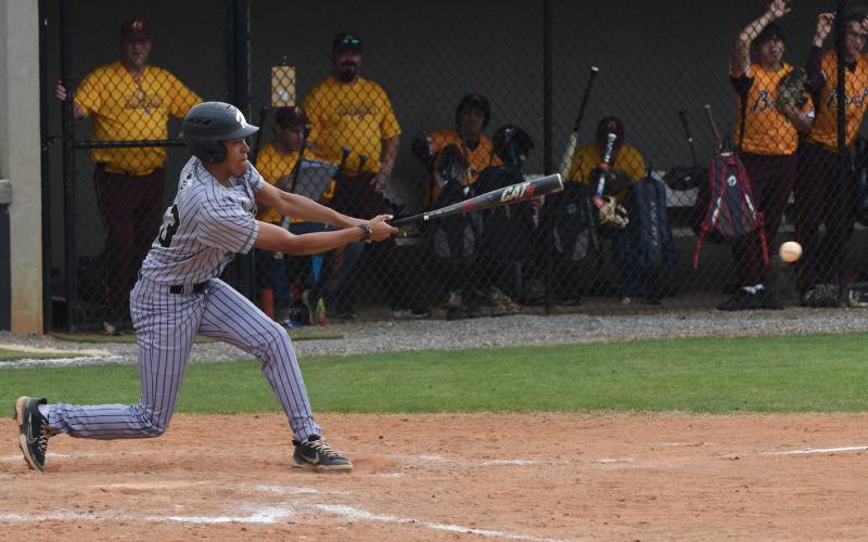 Gary Corsair • Clay County Progress Hayesville senior outfielder Shawn Plummer connects in the Yellow Jackets' 19-0 triumph over Cherokee. Plummer led the victors with three hits and scored 3 runs when the two teams met for the second time last week.