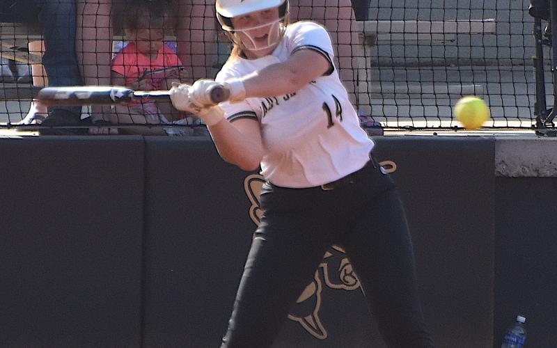 Gary Corsair • Clay County Progress Hayesville's Mallory Peck, No. 14, whacks a pitch during the Yellow Jackets' rematch with Murphy last week.