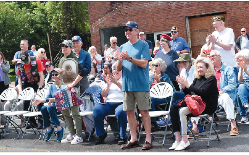 Becky Long • Clay County Progress Veterans receive recognition as they are called to stand when their branch of service is announced. Monday’s Memorial Day service drew around 100 attendees including many veterans.