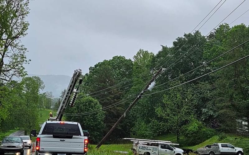 Photo by Misty Meadows The tornado damaged power poles brought down power lines throughout the Upper Peachtree area.
