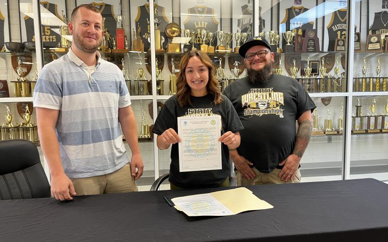 Deby Jo ferguson• Clay County Progress From left, Women’s Coach Daniel Sherlin, Lilliani Denton and dad, James Denton at the signing with Western New England Colleg.