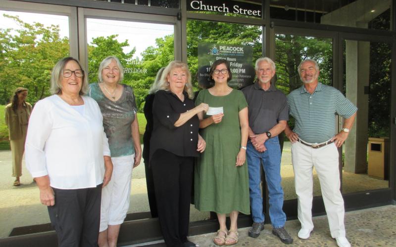 Historic Hayesville Inc. Board member Mil Puglisi and Friends of Historic Hayesville volunteer Paula Walters joined HHI Board member Marie Thompson for their presentation of $10,000 to Peacock Board member Virginia Mattox, Contractor Steven Ethridge and Peacock Board member Steve Massell to support renovation of the theater’s restrooms.