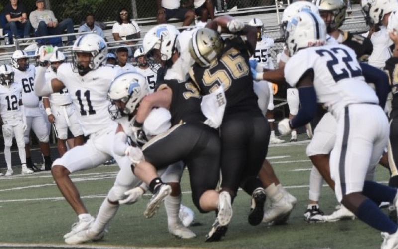 Leeanna Alberta • Clay County Progress Dawson Devane No. 32 and Will Brown No. 56 take down an Asheville player.