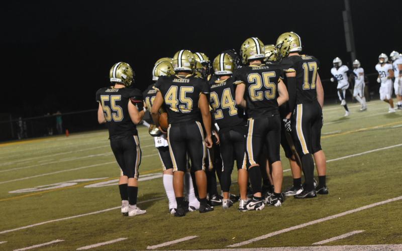 Leeanna Alberta • Clay County Progress  The Yellow Jackets huddle together to make a game plan.