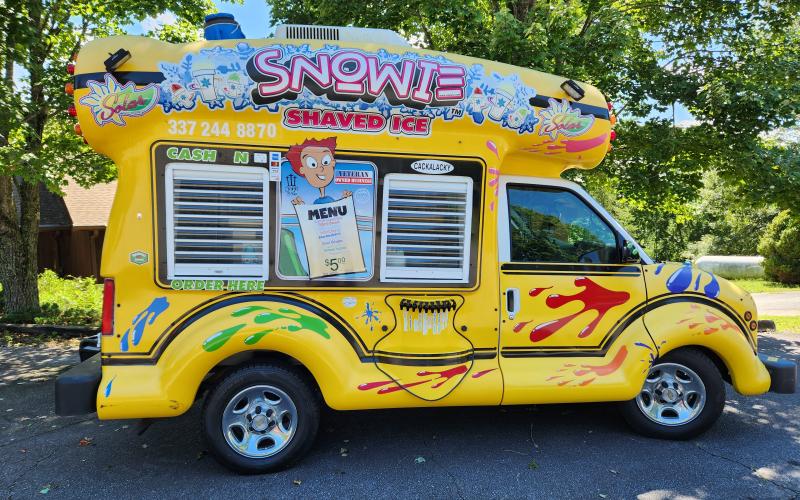 Photo submitted A Back-to-School Bash will be held at Hinton Center's Moore Hall in Hayesville from 1-5 p.m. Tuesday, Aug. 20. Snowie the snow cone truck arrived right on time to last year's event at Hinton and will return again this year so attendees of all ages may receive a free snow cone. There will also be 200 free backpacks for kids and additional school supplies while supplies last.