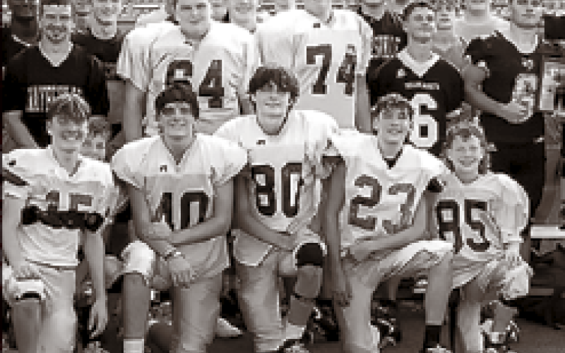 Hayesville Yellow Jacket players of all ages gather recently to pay tribute to the two Rosman teens, Layne Jones and Jayden Reynaldo who lost their lives in an ATV accident on Aug. 25. Some wore the Tiger’s signature orange in support the players and the Rosman community.