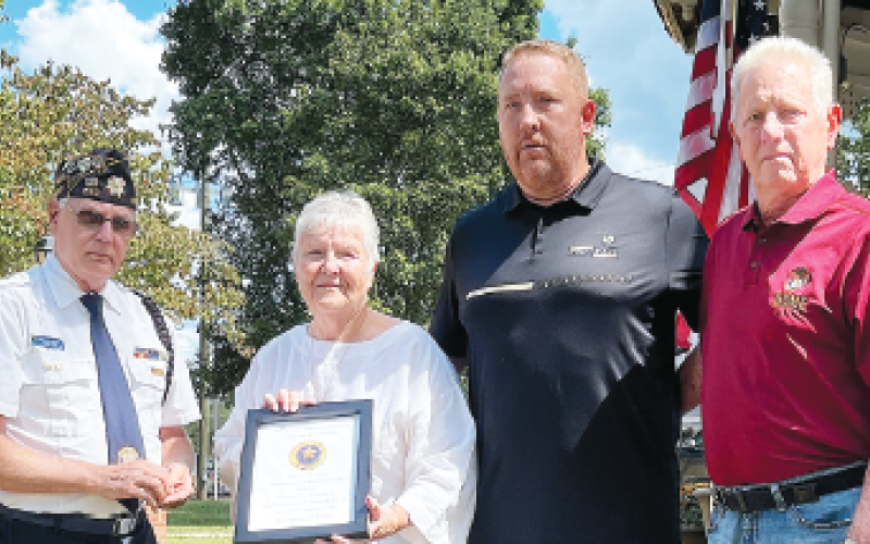 Paying honor to Capt. Fredrick Samuel Rowe Jr., WWI, was Gold Star family, from left presenter Phil Cantley and Terry, Rob and Tom Peck.