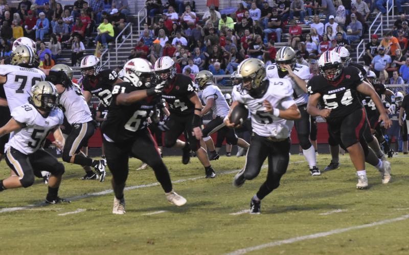 Leeanna Alberta • Clay County Progress  Hayesville’s Tate Roberts, No. 5, pushes the ball down the field in Friday’s game in Andrews.