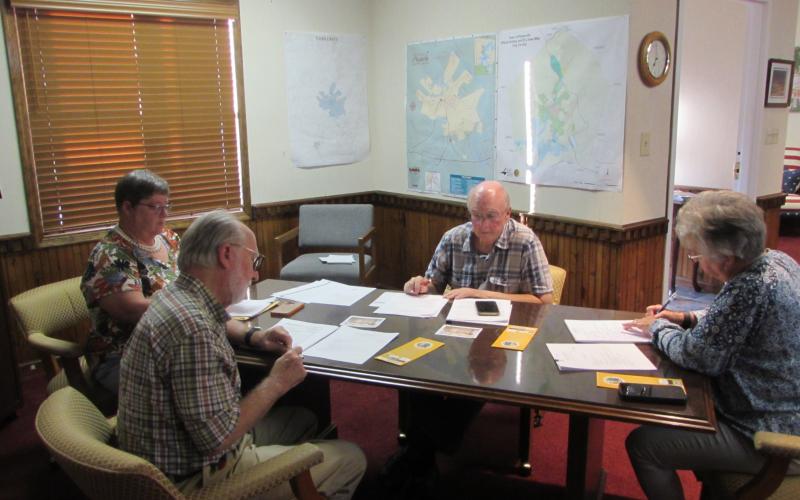 From left, Mayor Joe Slaton, council members, Benita England, Harry Baughn and Town Clerk/Finance Officer Suzanne Hedden discuss deterrence against panhandling in the town.