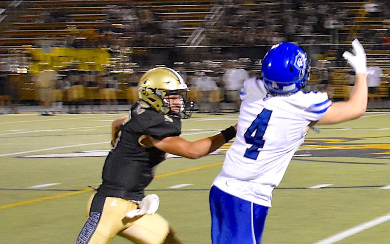 Gary Corsair • Clay County Progress Tate Roberts, No. 5, covers Georgia Force wide-out Wade Combee like a blanket. The pass fell incomplete.