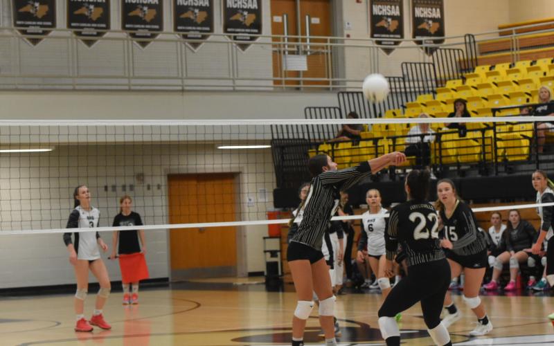 Leeanna Alberta • Clay County Progress Ava Shook, No.10, gets in a good hit with the back up from Bryleigh Krieger, No. 22, and Mallory Peck, No. 15.