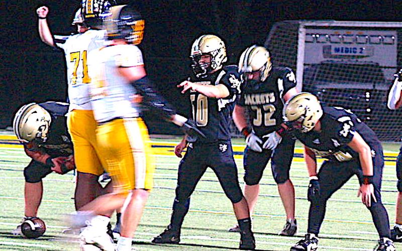 Gary Corsair • Clay County Progress Hayesville 5' 6," 150-pound guard Patrick Denton, No. 50, lets Murphy's 6' 5," 290-pound tackle Janthony Gooden, No. 71, know that he's coming for him.