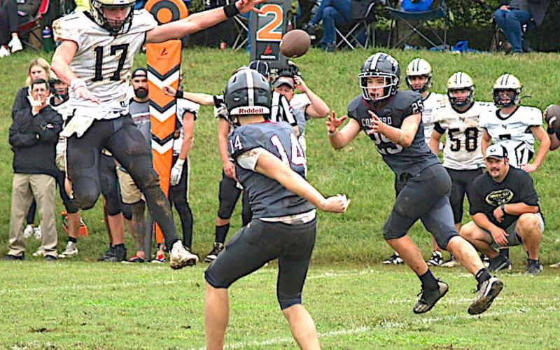 Gary Corsair • Clay County Progress Hayesville's Johan Webb, No. 17, goes airborne in an attempt to thwart a Concord Christian pitchout.