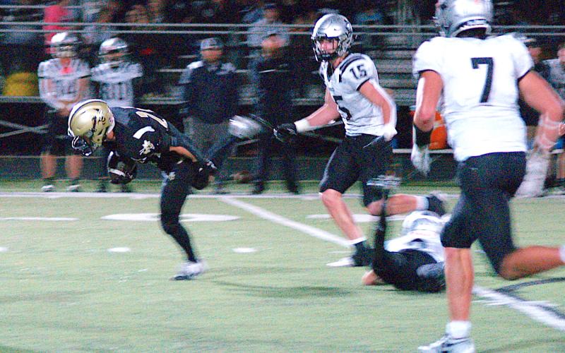 Gary Corsair • Clay County Progress Michael Mauney, No. 24, struggles to keep his footing after leaving Robbinsville defenders in his dust on a big gain for the Yellow Jackets.