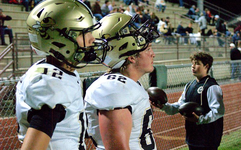 Gary Corsair• Clay County Progress Hayesville quarterback Lance Coker, No. 12, and his protector Caeden Chastain, No. 62, contemplate the state of affairs after Swain County scores to take a 7-6 lead.