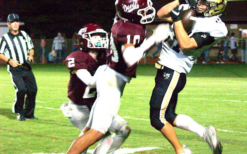 Gary Corsair• Clay County Progress Michael Mauney, No. 24, makes a sensational leaping catch despite a Swain County double team.