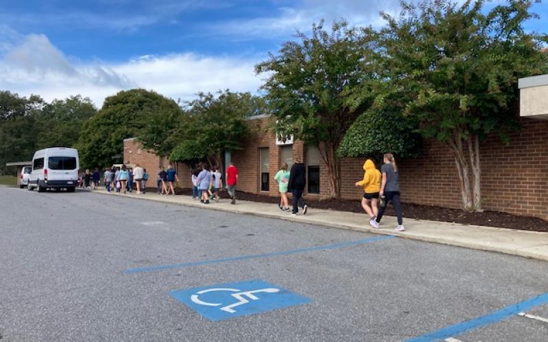 Marcia Barnes • Clay County Progress Hayesville students on the campus Tuesday morning. Bus transportation and classes resumed Monday, Sept. 30.