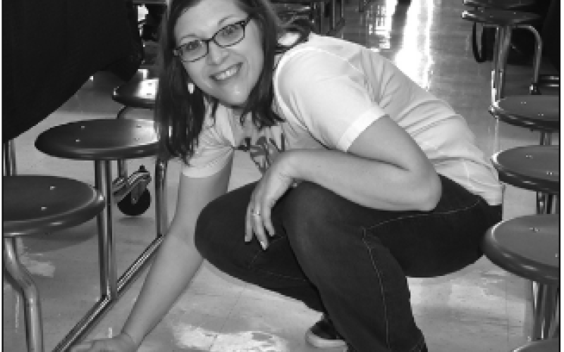 Volunteer Michelle Moore is all smiles even through clean-up duty.