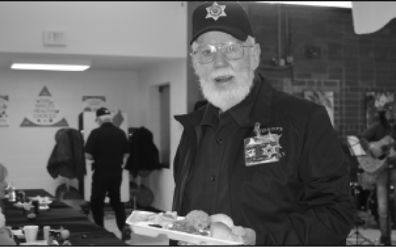 Johnny Claude Ashe takes a break from parking duty to enjoy a delicious meal with all the trimmings.