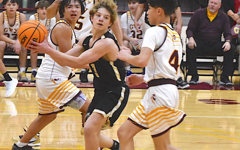 Gary Corsair • Clay County Progress Hayesville's Kyle Shaheen, No. 3, dishes to a teammate after dissecting the Cherokee defense.