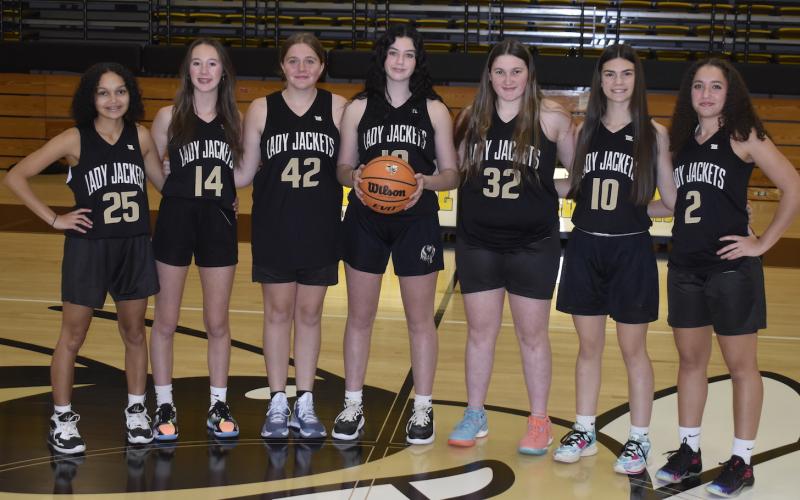 Gary Corsair • Clay County Progress The Hayesville JV girls basketball team, from left, Kadence Morrow, Olivia Free, Breanna Patterson, Micalynn McClure, Danielle Anderson, Kara Bauer and Aaliyah Jackson stands 1-0 and look to make noise in the Smoky Mountain Conference this year.