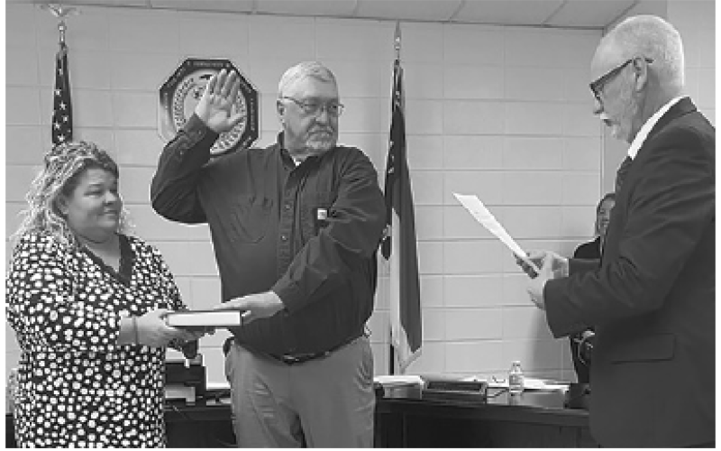 Clay County Schools Clay County School Board member Danny Jones was re-elected to the school board. Joining him for the swearing in ceremony is his wife Bobbie and Clerk of Court Tim Barrett conducting the oath of office.