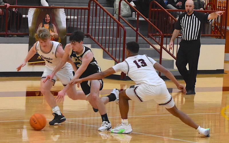 Gary Corsair • Clay County Progress Slade Crouch slices through Swain's defenders during the 2023 Smoky Mountain Conference Tournament. Crouch will quarterback the Hayesville offense in the Yellow Jackets season-opener at Towns County on Friday.