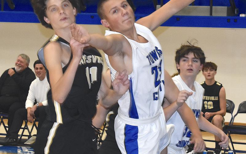 Gary Corsair • Clay County Progress Hayesville's Daemien Soto, No. 11, battles a Towns County player for the ball in JV action Friday.