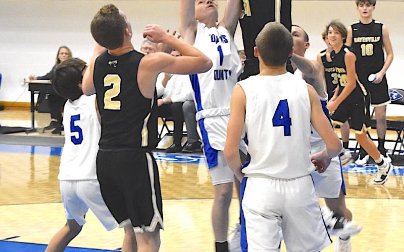 Gary Corsair • Clay County Progress Hayesville's Donivin Soto, No. 11, battles a Towns County player for the ball in JV action Friday.
