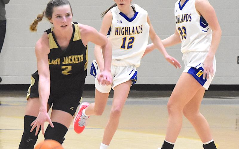 Gary Corsair • Clay County Progress.  Ava Shook leaves Highland defenders in the dust as she triggers Hayesville's offensive attack.