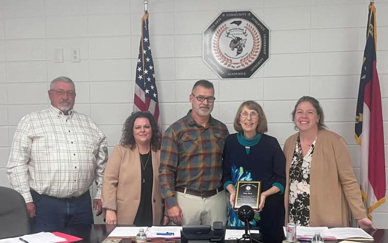 Clay County Schools Reba Beck is honored for service to the community and schools on Monday, Nov. 25 by Clay County Schools Board of Education members, from left, Danny Jones, Kelly Crawford, Dr. Jason Shook, Beck and Superintendent Melissa Godfrey.