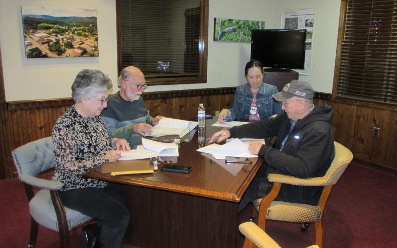 Lorraine Bennett • Clay County Progress Members of the Hayesville Town Council preparing for Monday evening’s meeting are, from left, Town Clerk/Finance Officer Suzanne Hedden, Mayor Joe Slaton, Councilwoman Lauren Tiger and Councilman Harry Baughn. Councilwoman Benita England was absent.