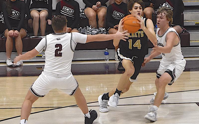 Gary Corsair • Clay County Progress Brady Reynolds, No. 14, slices through Swain County's zone defense as Hayesville rolls to a road win in Smoky Mountain Conference play.