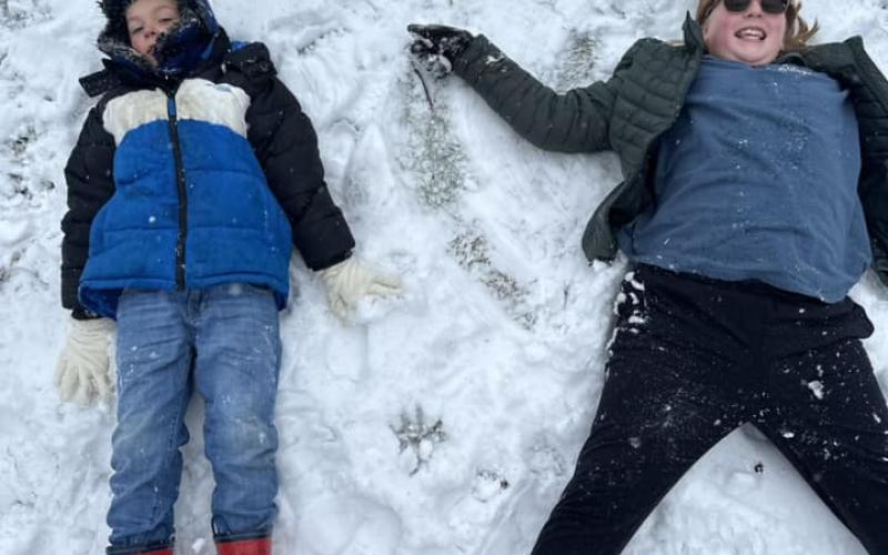 Blayne Mullins and Claire Kimsey don’t seem to mind the chill as they stretch to make their best snow angels. See more submitted snow photos from Facebook