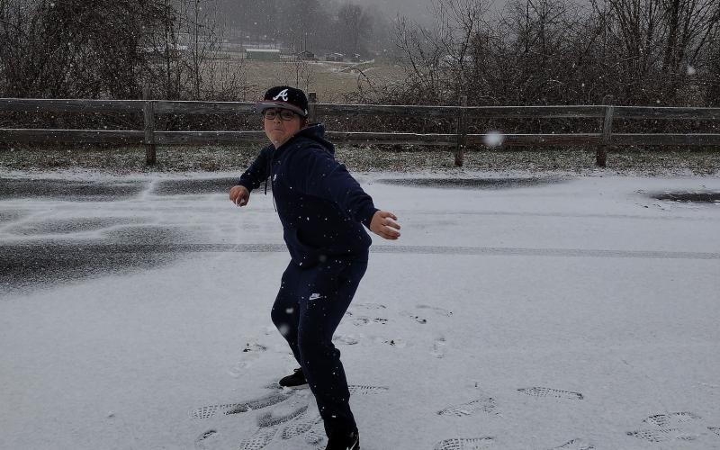 Easton Parton does the snow dance hoping to keep it coming allowing him one more day home from scho