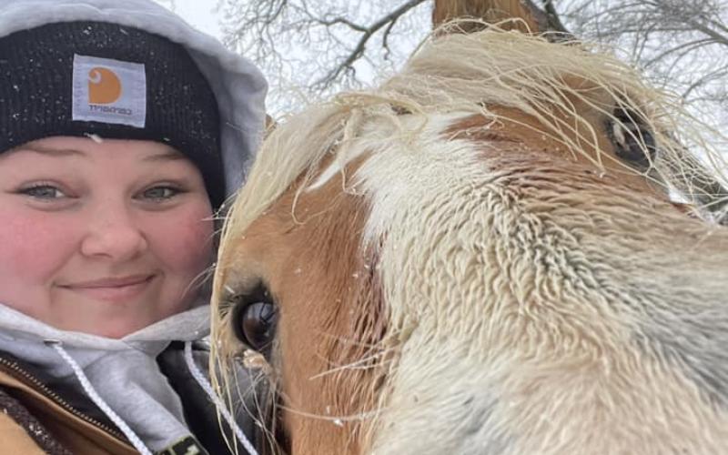 Kiera Guffey and horse Charlie enjoy the snow day.