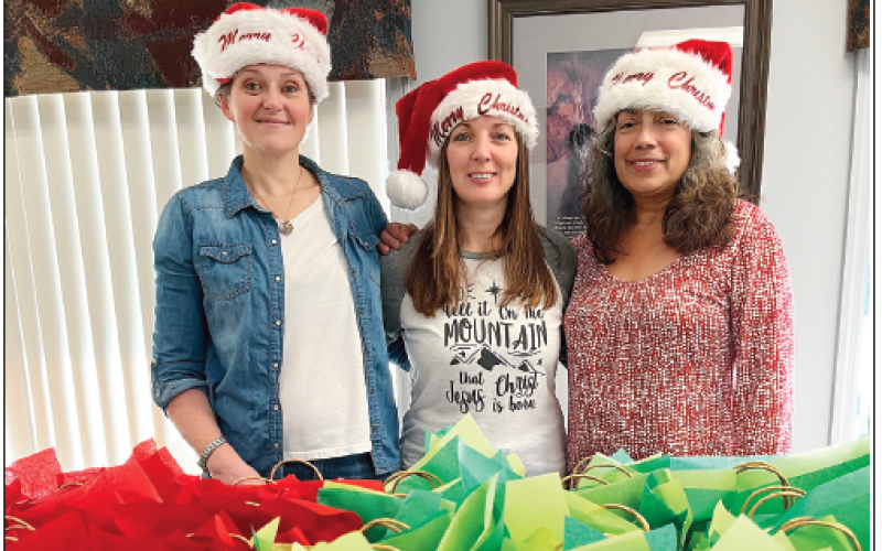 Deby Jo Ferguson • Clay County Progress On right, REACH of Clay County gives back to the community with gifts to Meals on Wheels recipients. From left are Sommer Rector with REACH; Becky Grindstaff, Clay County Senior Center director; and Judith Alvarado executive director at REACH.