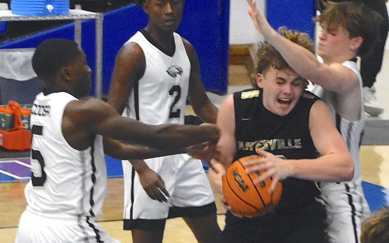Gary Corsair • Clay County Progress Hayesville big man Jackson Sellers, No. 33, muscles his way to the basket against Coosa.