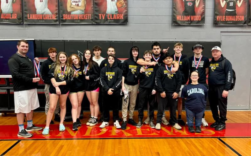 The Hayesville High School wrestling team consist of, front from left, Coach Colby White, Amelia Manning, Fara Ammons, Pyper Leford, Jack Eskildsen, Kaden Harbuck, Parker Hughes, Edwin Nava and Manager Norashae Patterson; back, Silas Lovingood, Logan Querns, Robert Manning, Rayland Martinez, Jameson Dawson, Andrew Reynolds and Coach Andrew Reynolds.