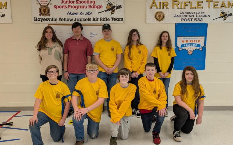 The Hayesville Yellow Jacket Air Rifle Team members are, from front left, Jaxin Eubanks, Rockie Brown, Masyn Parrinello, Nathan Fisher and Wednesday Johnson; back, Maggie McClure, Will Jennings, Devin Ramey, Leyah Parrinello and Zoe Angelopulos. Team members not shown are Hunter Chastain, Lucas Brown, Ryder Schaffer and Ragen Schaffer.