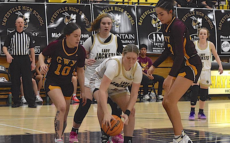 Gary Corsair • Clay County Progress Brooke Graves, No. 40, scrambles for the ball as Mallory Peck, No. 35, and Breanna Abrams, No. 4, watch.