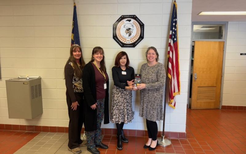 From left, Karen Dudley, Hannah Miller, Mary Jo Dyer, State Farm Marketing Director and Superintendent Melissa Godfrey signify the inclusion of Clay County Schools in the Go the Extra Mile Shoe Fund on Tuesday, Feb. 4.