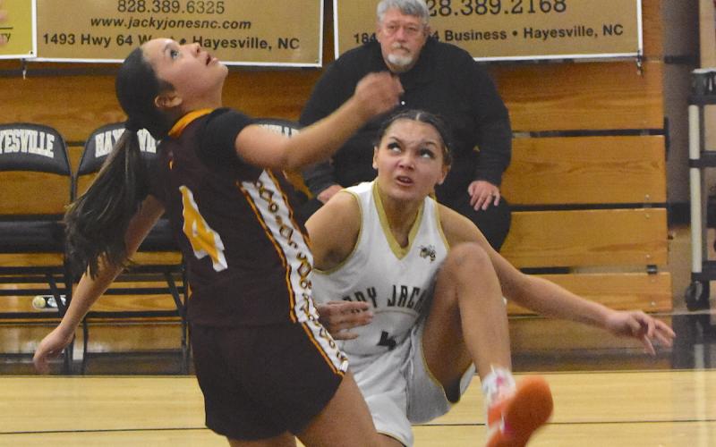 Gary Corsair • Clay County Progress Kadence Morrow, No. 4, watches her shot as she falls to the deck in attempt to put two on the scoreboard for Hayesville.