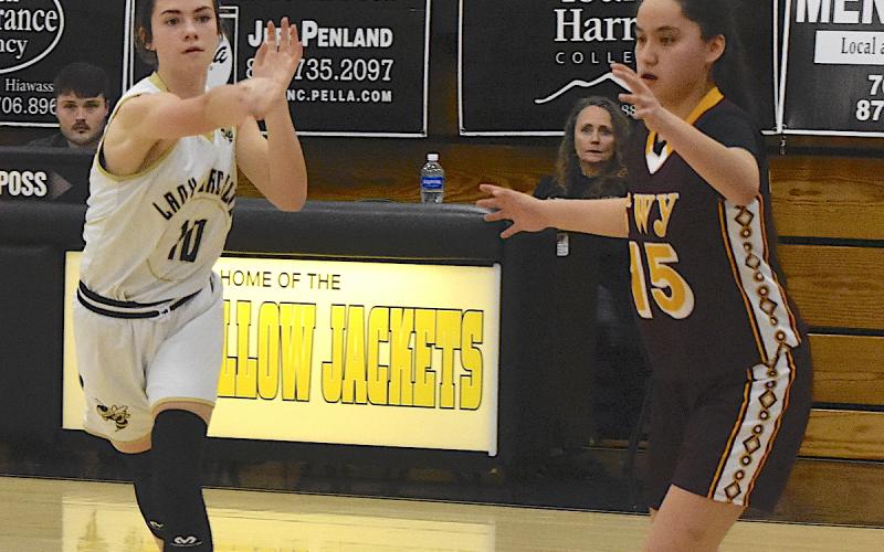 Gary Corsair • Progress Hayesville spark-plug Micallyn McClure, No. 10, zips a pass to the corner for the final shot of the game during a 32-29 overtime loss to Cherokee. Unfortunately, the Lady Jackets didn't get the tying basket.