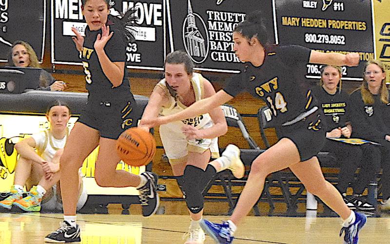 Gary Corsair • Clay County Progress Hayesville's Ava Shook, No. 2, fights to keep her balance as she splits Cherokee's oppressive full-court press.